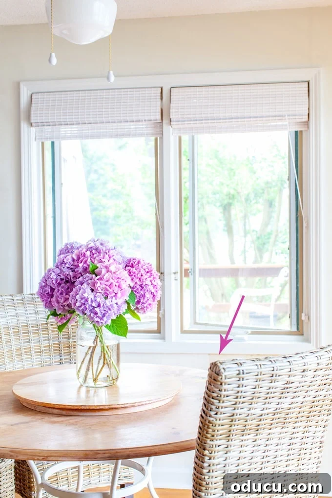 Elevate Your Dining Room with Textured Wallpaper 2 Hydrangeas on kitchen table against white textured wallpaper