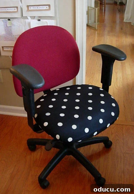Original Office Chair Fabric Red office chair with polka dot fabric being removed to reveal original upholstery