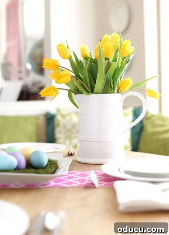 Beautiful Flower Arrangements Made Simple 9 Easter table setting featuring a white ceramic pitcher filled with vibrant flowers.