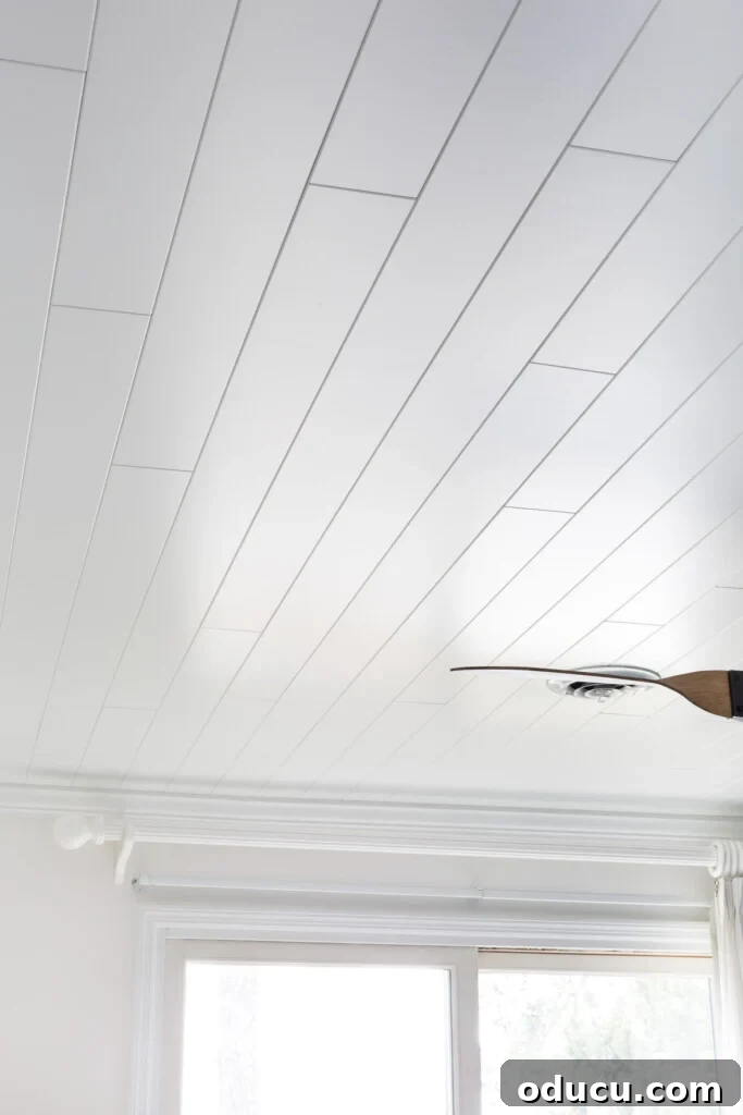 Armstrong WoodHaven Planks in Painted White on a bedroom ceiling.