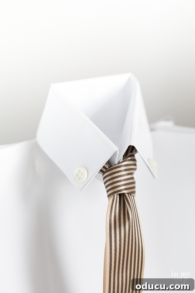 Dad's Heartwarming Father's Day Gift Bag 3 Close-up of a charming Father's Day gift bag crafted to look like a shirt and tie, showcasing clever gift wrapping for men.
