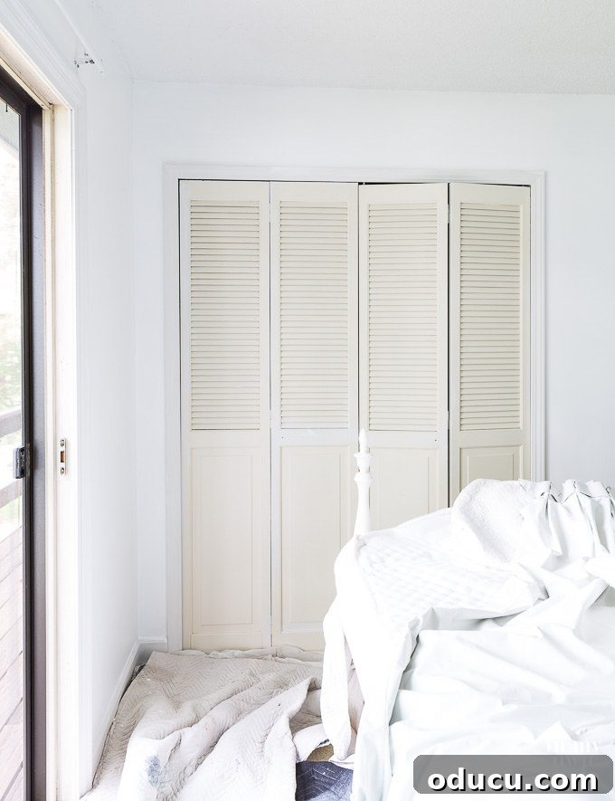 Guest Room Revamp in Motion 4 Guest room makeover in progress showcasing freshly painted doors and walls