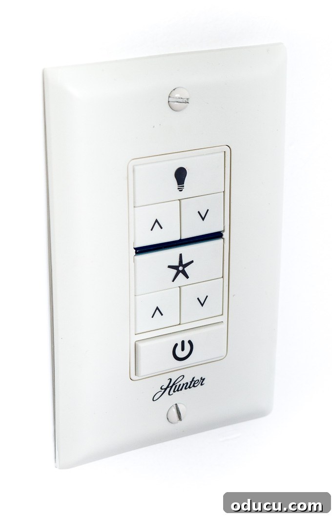 Guest Room Revamp in Motion 8 Convenient and sleek wall remote for the Hunter Hepburn ceiling fan, controlling speed and light