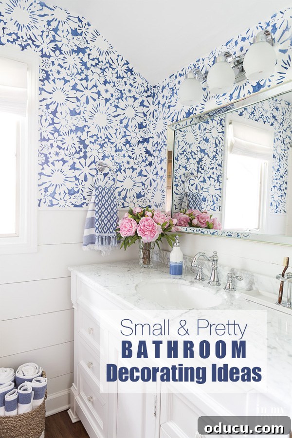The Ultimate Small Bathroom Glow-Up 6 Blue and White small bathroom with stenciled walls and white vanity.