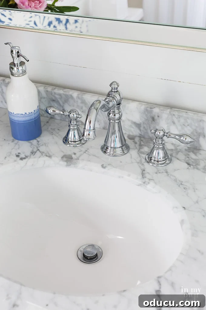 Marble topped vanity in small bathroom Marble topped vanity in small bathroom