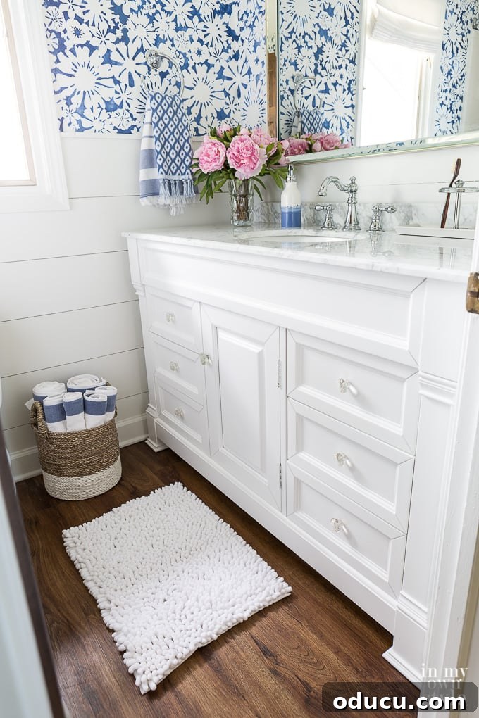 Blue and white floral stenciled walls in bathroom Blue and white floral stenciled walls in bathroom