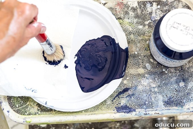Achieve the Faux Wallpaper Look with Paint and Stencils 11 Key stenciling technique: off-loading paint from brush to prevent bleed