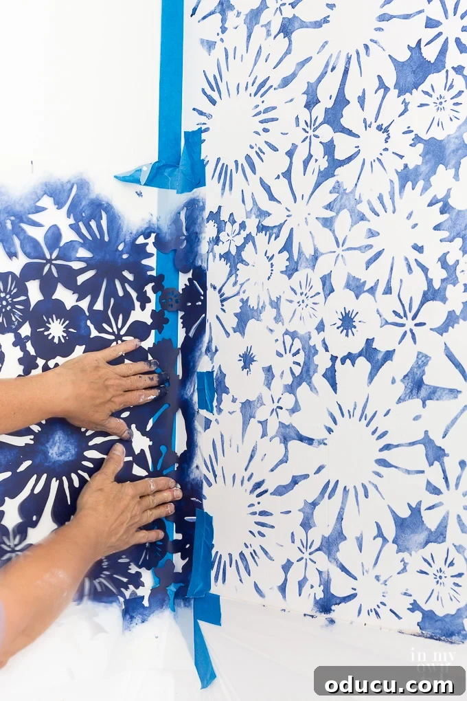 Achieve the Faux Wallpaper Look with Paint and Stencils 18 Maintaining stencil flatness against the wall while painting in corners