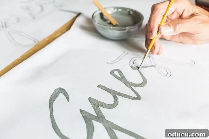 Craft a Custom Pom Pom Pillow 12 How to paint words, quotes and sayings on fabric
