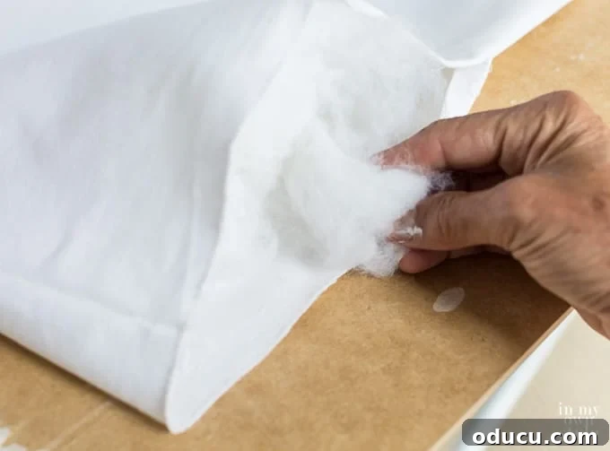 Craft a Custom Pom Pom Pillow 13 How to stuff a pillow cover with batting