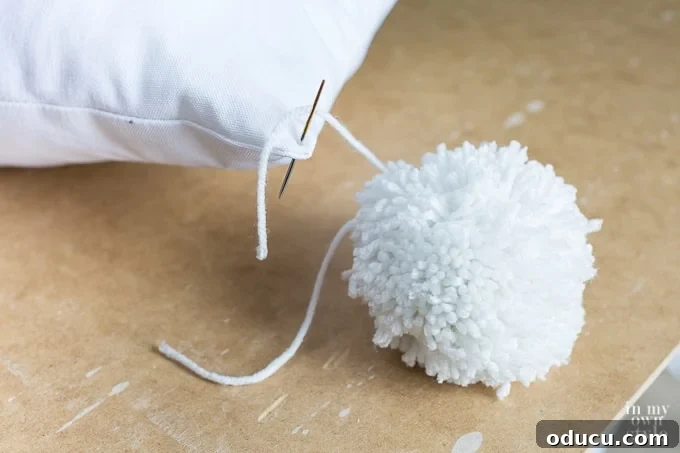 Craft a Custom Pom Pom Pillow 15 How to attach a pom-pom to a pillow
