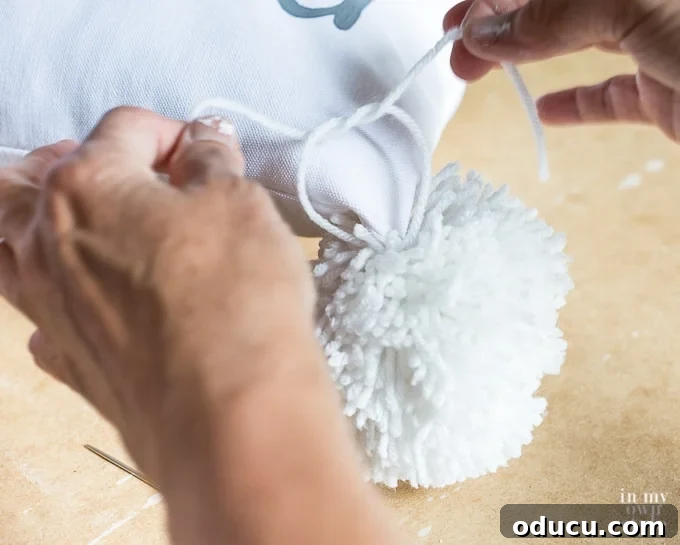 Craft a Custom Pom Pom Pillow 16 How to attach a pom-pom to a pillow
