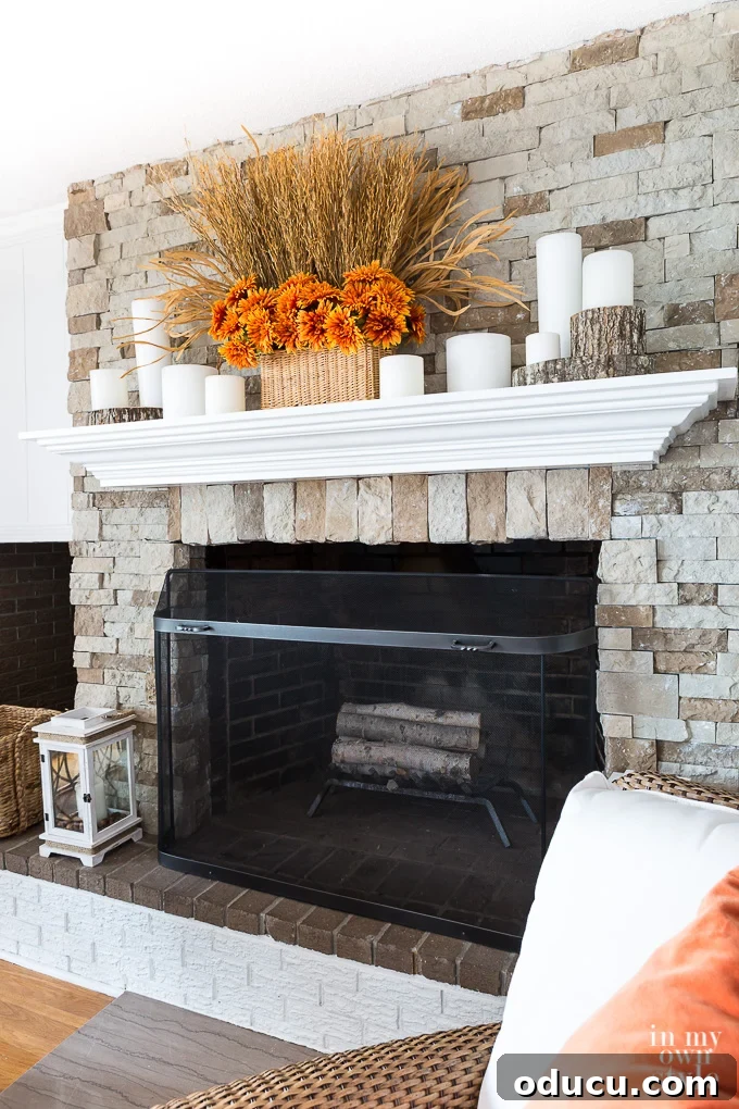 Effortless Autumn Mantel Styling 6 Fall mantel decorating idea using candles and natural wood elements