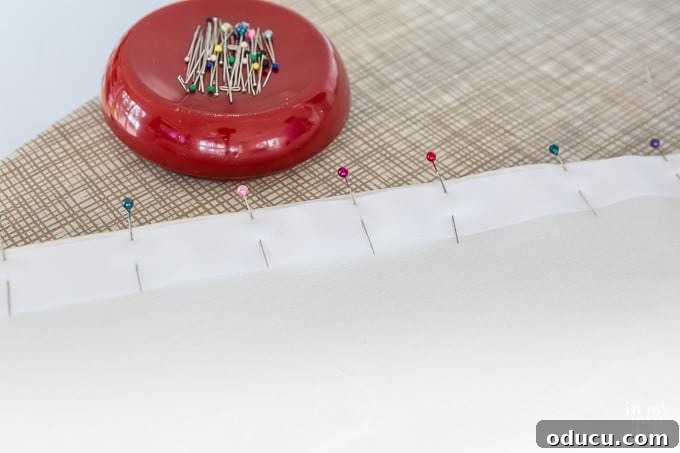 Stylish Ottoman Slipcover with Detachable Pom Pom Accent 16 Step-by-step DIY tutorial showing how to make an Ottoman Slipcover with Removable Large Pom Pom Trim