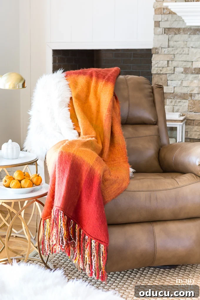 Recliner Chic: Elevating Your Living Room's Style 14 Leather recliner in living room with fall throw blanket and fur over the arm.
