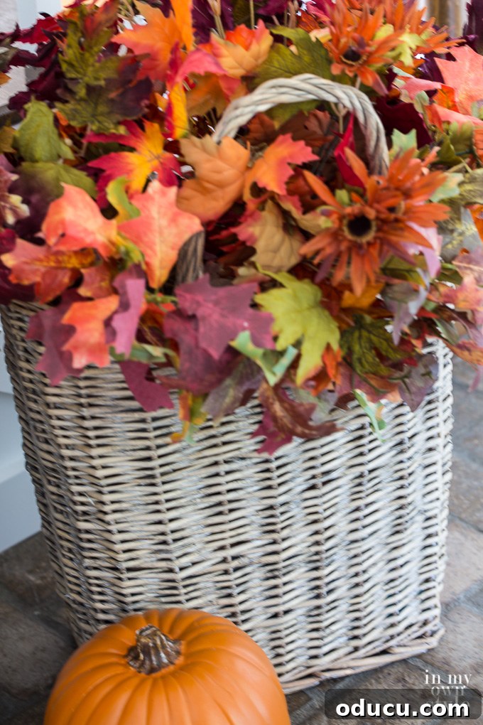 Falling for Our Home: An Autumn Showcase 4 Tall vintage basket filled with fall flowers used to decorate for fall.