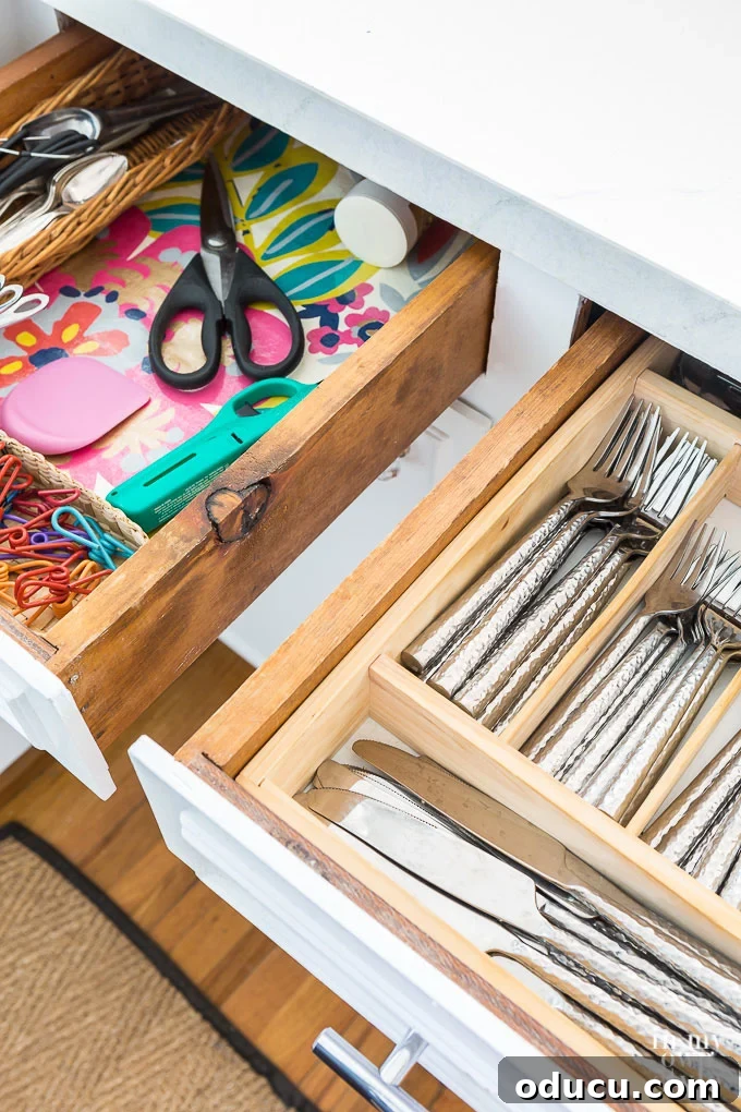 Organized drawer with a new liner and contents How-to-line-any-drawer-with-fabric-or-paper