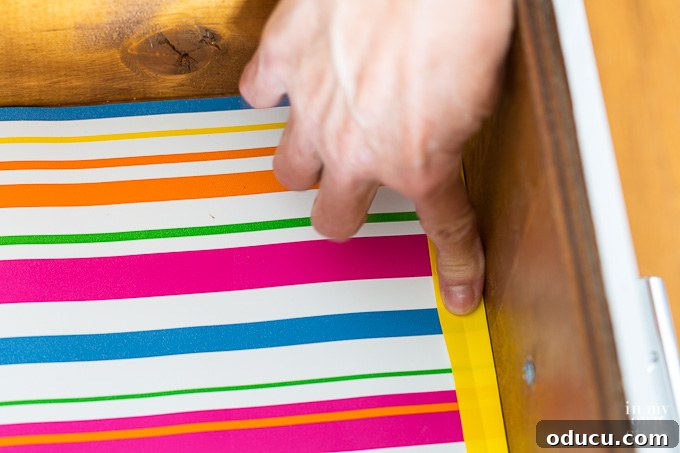 Folding the excess paper to create a crease How to fit drawer liners like a pro