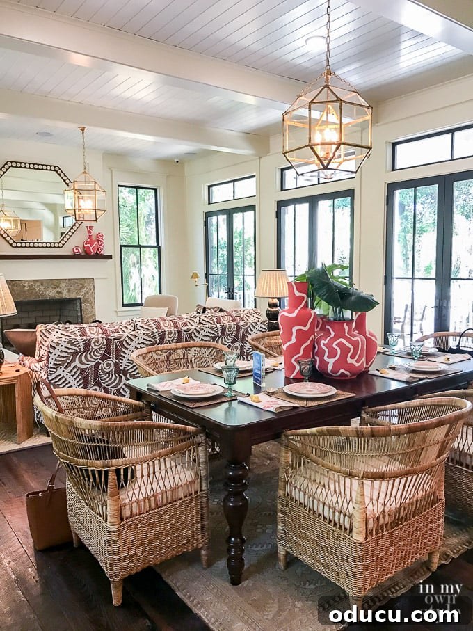 Design Dreams Unveiled at the Southern Living Idea House 16 Elegant dining table featuring vintage wicker seating, highlighting eclectic coastal design
