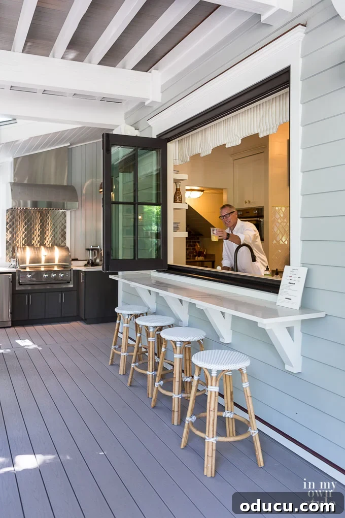 Design Dreams Unveiled at the Southern Living Idea House 19 Architect Eric Moser serving drinks through the innovative bi-fold kitchen window at the Southern Living Idea House