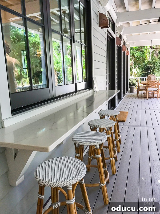 Design Dreams Unveiled at the Southern Living Idea House 21 Outdoor bar area with the bi-fold window open, connecting the kitchen to the exterior entertaining space