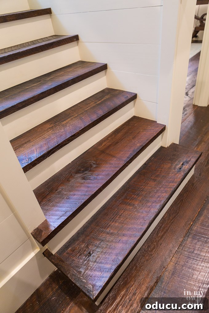 Design Dreams Unveiled at the Southern Living Idea House 25 Reclaimed pine wood staircase at the Southern Living Idea House, showcasing rustic charm and natural beauty