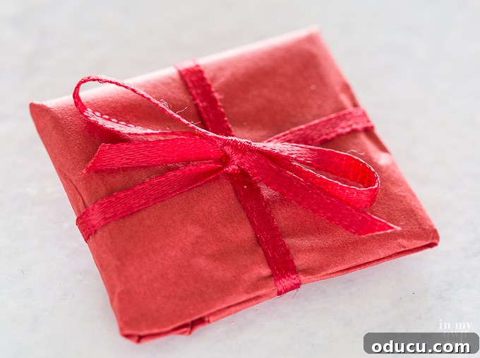 Hidden Treasure Star Ornament for Christmas 16 Gift wrapped package that goes into star ornament before being sewn closed.