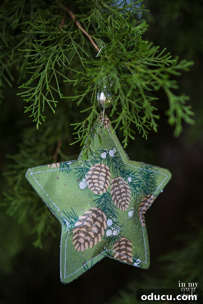 Hidden Treasure Star Ornament for Christmas 8 Christmas star paper ornament to make using scrapbook paper. It gets ripped open on Christmas morning to find a small gift inside.