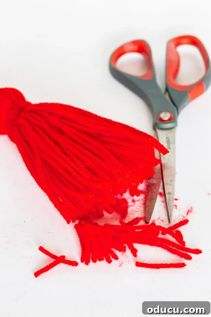 Craft Your Own Tassels: Elevate Your Home Decor 10 Cutting bottom with scissors to trim