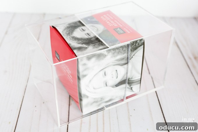 Elevated Christmas Photo Keepsake 9 Opening an acrylic photo cube for pictures