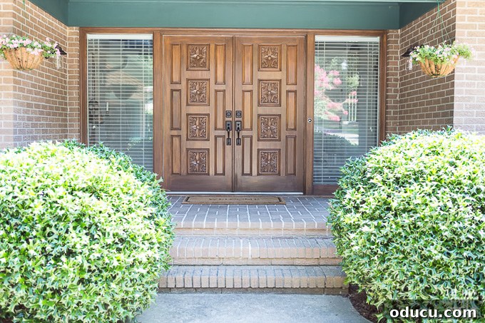 Elevate Your Curb Appeal Nu-Wood Exterior Makeover 3 Close-up of modern front doors with faux woodgrain finish on a contemporary house