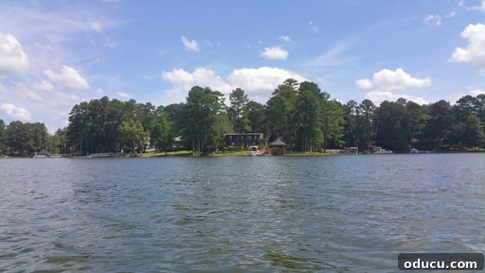 Elevate Your Curb Appeal Nu-Wood Exterior Makeover 8 View of a lake house from the water, highlighting the shed dormer