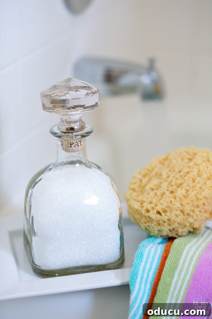 Festive Folds and Finishing Touches 9 How to repurpose a Patron bottle into a pretty bottle with a crystal top to hold bath salts, emphasizing self-care