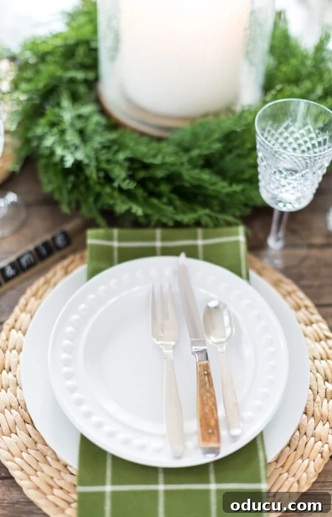 Simple and green Christmas table setting idea using dark wood paper as a table cloth.