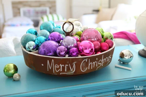 Christmas ornaments in a large bowl on a table.