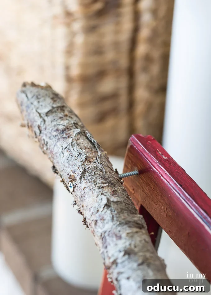 Frosted Window Mantelscape 18 How to attach a tree branch to a Christmas mantel window sash