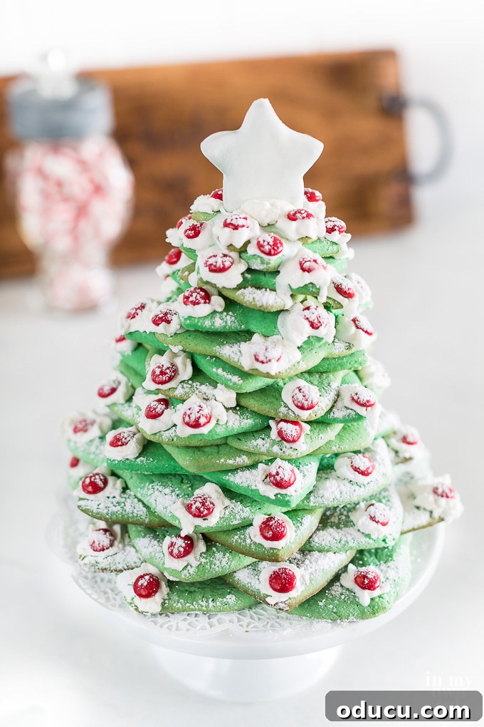 Deck the Halls with Edible Cookie Trees 8 A Wilton Christmas cookie tree expertly made using star-shaped cookie cutters, serving as an exquisite holiday decor piece.