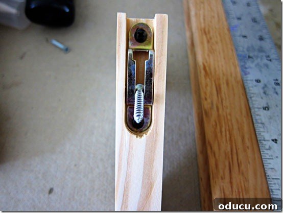 Screw-fits-in-bracket-like- Demonstration of screw fitting into bracket hook.