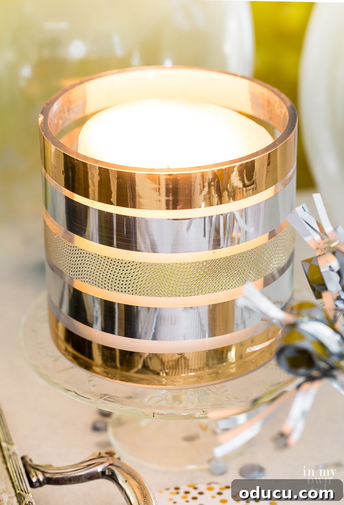 Quirky New Year Fun with Duck Mirrors and Texture Tape 13 New Year's Eve party ideas featuring a metallic pillar candle holder created with decorative Duck Tape