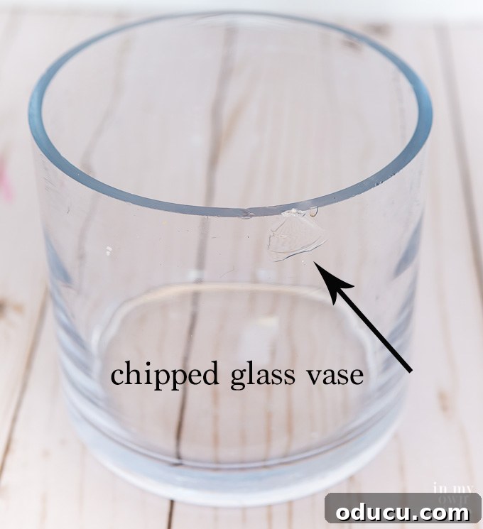 Quirky New Year Fun with Duck Mirrors and Texture Tape 4 A chipped glass vase with a noticeable imperfection before its Duck Tape transformation