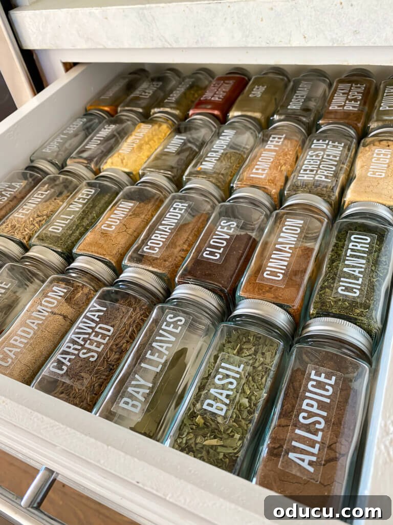 Pantry Closet Transformation 24 Organized spice drawer in kitchen after receiving a set of matching glass spice jars, arranged alphabetically