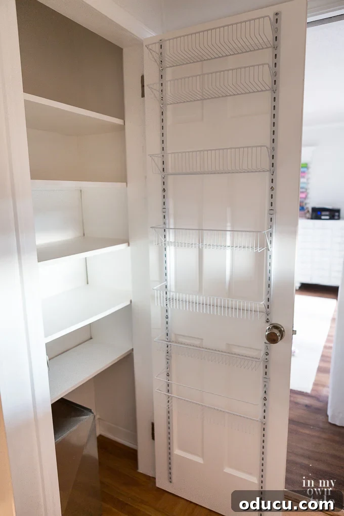 Pantry Closet Transformation 10 Close-up of the wire door rack installation process, showing where it was modified
