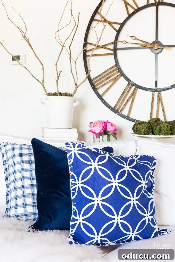 Turn Cloth Napkins into Unique Throw Pillow Covers 17 A display of blue and white napkin-covered pillows, showcasing the charming result of repurposing cloth napkins into decorative home accents.