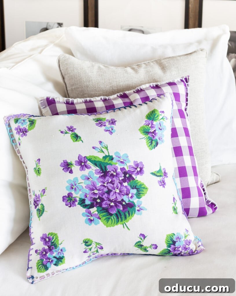 Turn Cloth Napkins into Unique Throw Pillow Covers 5 A living room sofa adorned with repurposed old cloth napkins used as stylish pillow covers, demonstrating unique home styling.