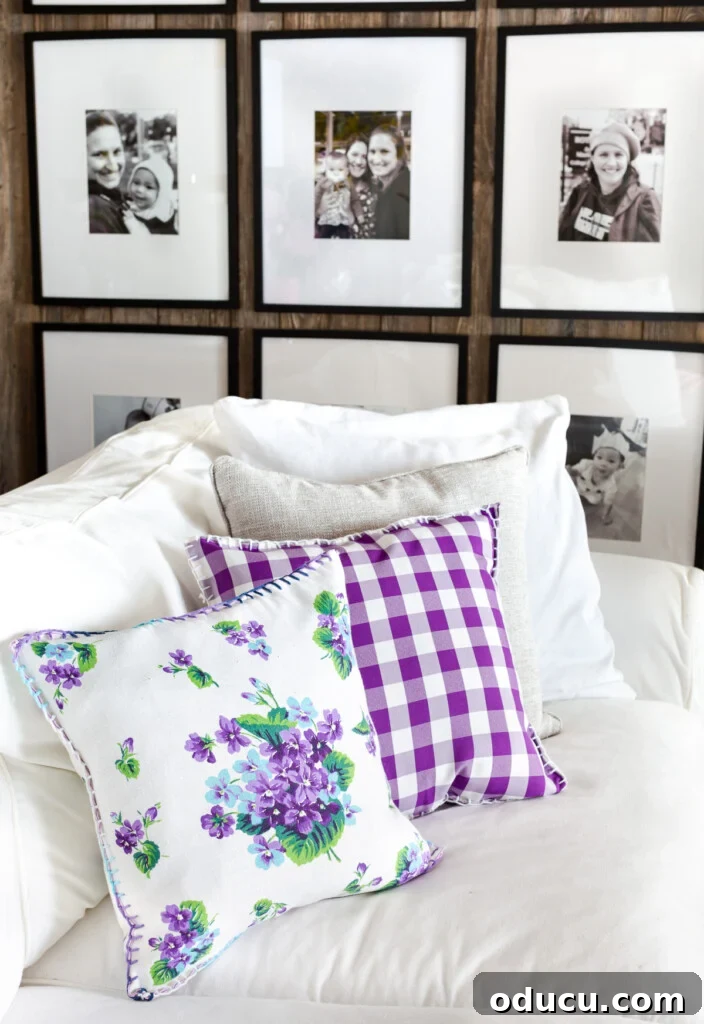 Turn Cloth Napkins into Unique Throw Pillow Covers 6 A pair of throw pillows on a sofa, crafted from purple and white old cloth napkins, showcasing a creative DIY home decor project.