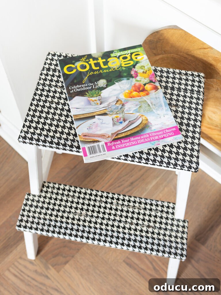 Spring decor magazine displayed on a stool in a kitchen, adding unexpected color.