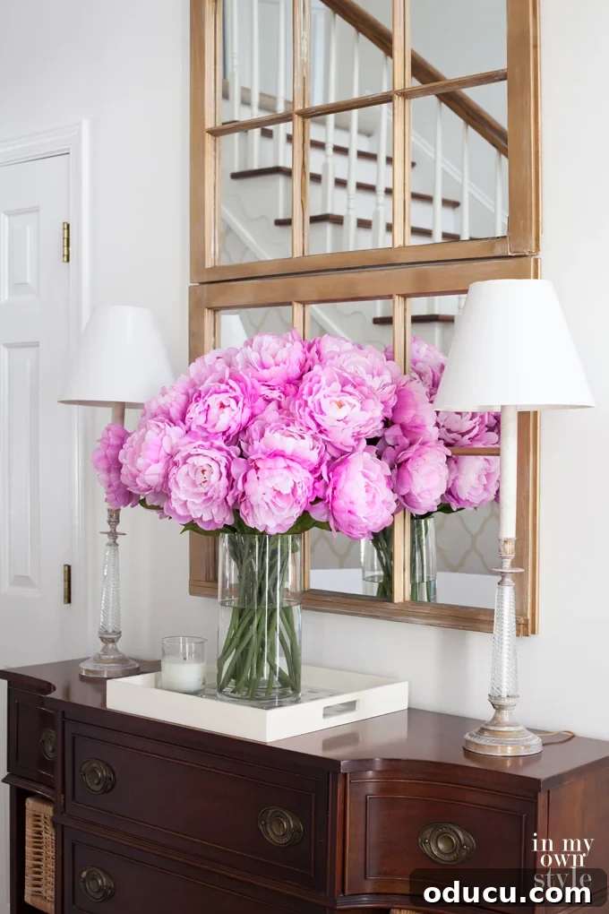 Effortless Spring Coffee Table Tray Decor 10 Decorating ideas using fake flowers on a tray for year-round beauty.