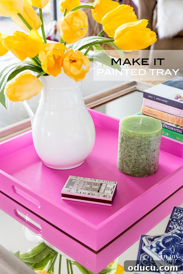 Effortless Spring Coffee Table Tray Decor 13 Coffee table styling idea using a tray. How to paint a tray to coordinate with a room's decor. Pink painted decorative tray, showcasing spring elegance.