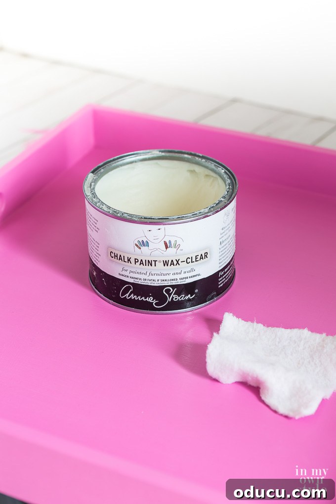 Effortless Spring Coffee Table Tray Decor 7 How to paint a tray pink and seal it with wax for durability.