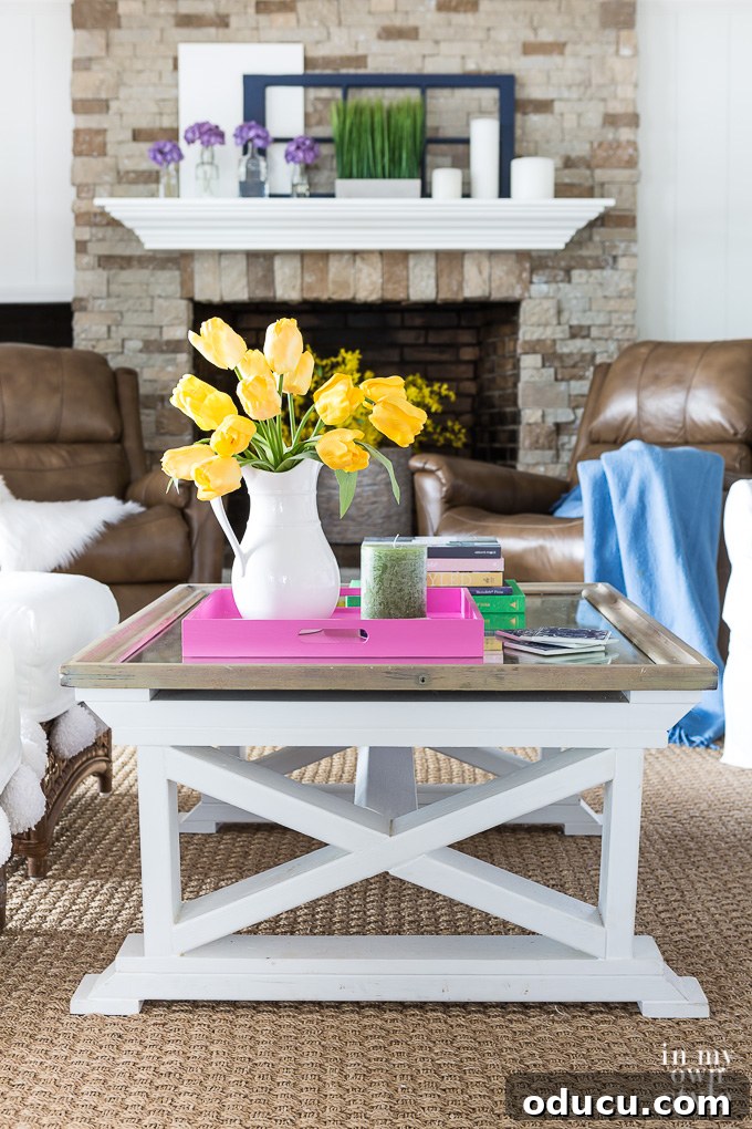 Effortless Spring Coffee Table Tray Decor 9 Spring decorating in a living room made easy and on a budget with this spring coffee table styling tray hack, featuring fresh flowers.